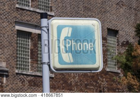 Sign For An Ancient Pay Phone. Before Cell Phones In The 20th And Early 21st Centuries, People Were 