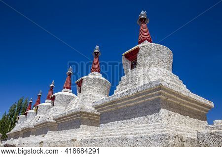 White Buddhist Stupa Or Pagoda In Tibetan Monastery Near Village Leh In Ladakh Region, Noth India