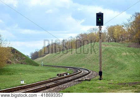 Selective Focus Railway Green Lantern Of Semaphore Railroad Enable, Allow Permit Track That Twists A