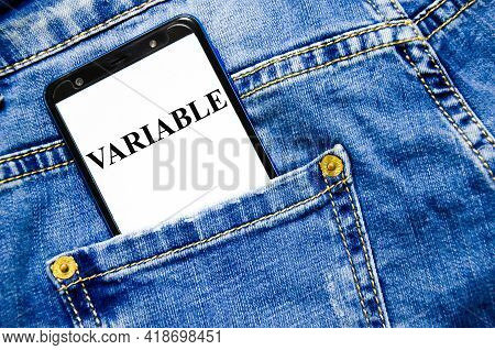 The Variable Word Written On The White Screen Of The Phone Shortly Lies In Jeans