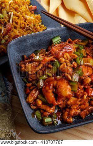 Takeout Chinese Kung Pao Chicken And Shrimp With Peanuts And Side Of Pork Fried Rice