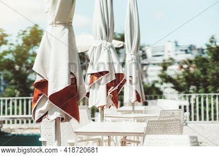 View Of A Closed Empty Street Restaurant Or A Cafe During A Lockdown Or A Quarantine With No People 