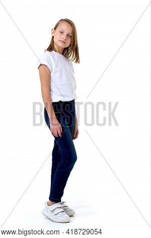 Blonde In A White T-shirt In The Studio On A White Background.