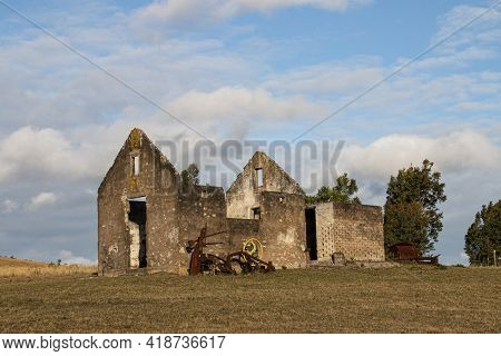 Derelect Dilapidated Building Perched On Rounded Hill