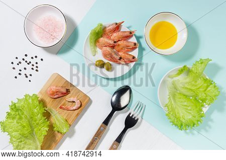 Healthy Lifestyle - Cooking Of Fresh Salad Of Prawn, Green Salad, Olive, Black Pepper, Pink Salt In 