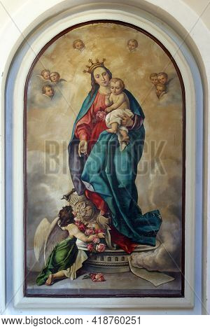 LUN, CROATIA - AUGUST 17, 2013: Virgin Mary with baby Jesus altarpiece at St. Jerome parish church in Lun, Croatia