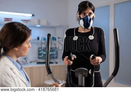 Tired Athlete Woman Training On Cross Trainer