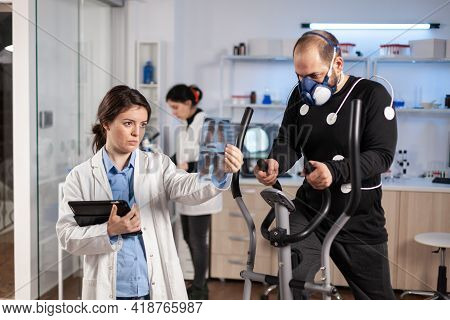Sport Medical Doctor Looking At Athlete X-ray