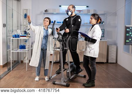Doctor In Sport Performance And Athlete Looking At Ar Screen