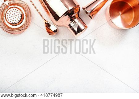 Set Of Copper Bar Tools For Making Cocktails, White Background, Top View Banner