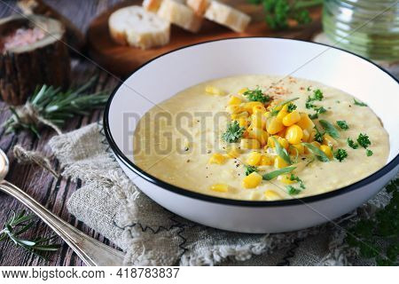 Corn Chowder. American Cuisine. Creamy Corn Soup, Green Onions And Parsley Dressing. Rustic Style