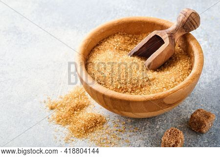 Cane Sugar Cube In Bamboo Bowl On Gray Table Concrete Background. Top View.
