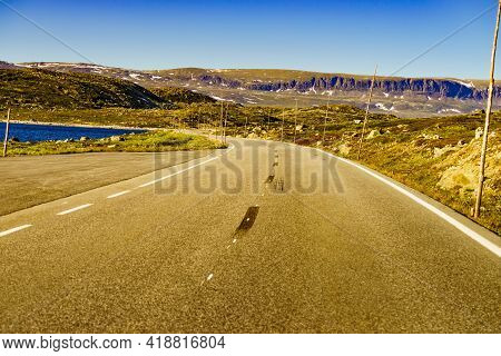 Road Crossing Hardangervidda Plateau, Norway Landscape. National Tourist Hardangervidda Route.