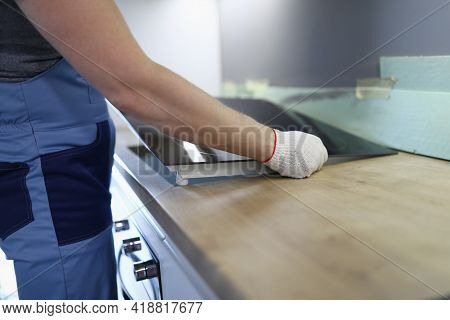 Master Installs Electric Hob On Kitchen Cabinet