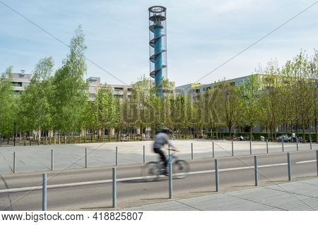 Zurich, Oerlikon - April 19th 2020: A Cyclist Crossing Oerliker Park