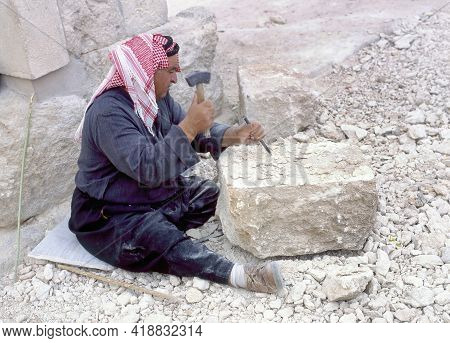 Jerash,jordan-april 27,2018:arab Stonemason At Work To Restore The Ancient City Of Jerash