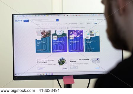 New York, Usa - 26 April 2021: Coursera Website Page On Screen, Man Using Service, Illustrative Edit