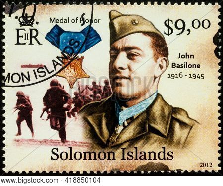 Moscow, Russia - April 27, 2021: Stamp Printed In Solomon Islands, Shows John Basilone, Us Marine Co