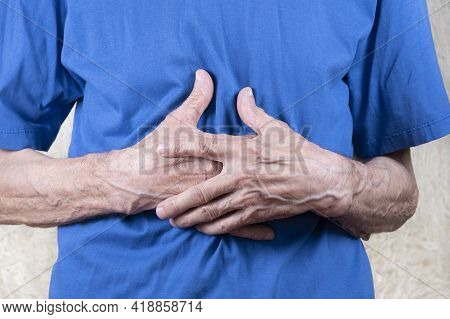 Elderly Man Hands Holding Stomach, Suffering From Stomachache. White Background