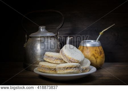 Plate Of Fried Quince And Sweet Potato Pastries With Mate.gastrnomia Argentina