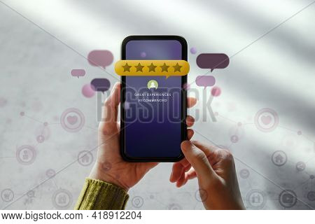Customer Experiences Concept. Happy Client Using Smartphone To Reading Review Rating For Online Sati