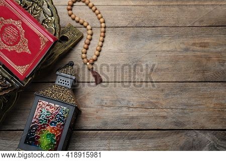 Arabic Lantern, Quran And Misbaha On Wooden Table, Flat Lay. Space For Text
