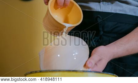 Professional Male Potter Preparing Ceramic Wares For Burning In Pottery Kiln With Milk - Old Russian