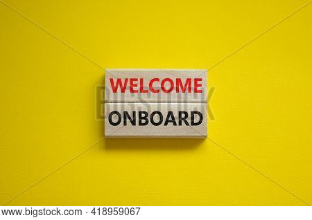 Welcome Onboard Symbol. Wooden Blocks With Words 'welcome Onboard' On Beautiful Yellow Background. B