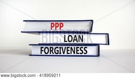 Ppp, Paycheck Protection Program Loan Forgiveness. Concept Words Ppp Loan Forgiveness On Books On Wh