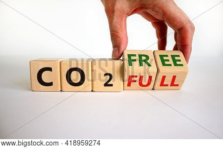 Co2 Full Or Free Symbol. Businessman Turns Cubes, Changes Concept Words 'co2 Full' To 'co2 Free'. Be