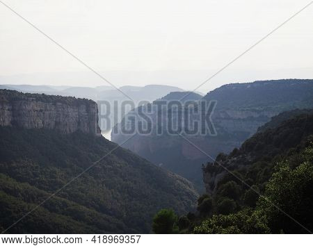 Panorama View Of Stone Rock Cliff Gorge Canyon With Green Grass Meadow Fields Near Tavertet Osona Ba