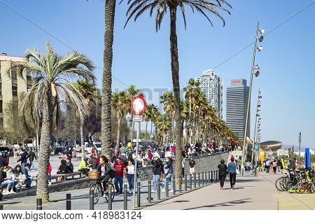 Spain, Barcelona, March, 2021: People Walking On Barceloneta Is A Neighborhood In The Ciutat Vella D