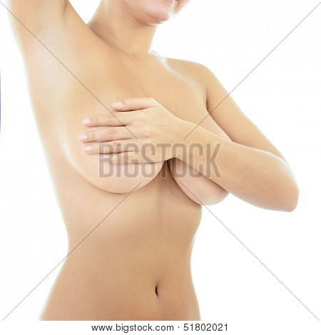 Body of beautiful woman covering her breast and showing armpit, over white