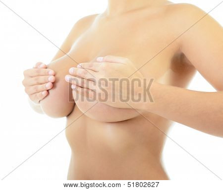 Body of beautiful woman covering her breast, over white