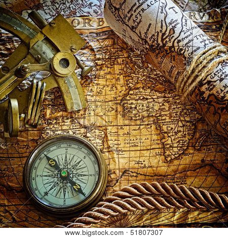 vintage  still life with compass,sextant and old map.  map used for background is in Public domain. Map source: Library of Congress. Country: Belgium Year: 1570. Author: Abraham Ortelius (1527-1598)