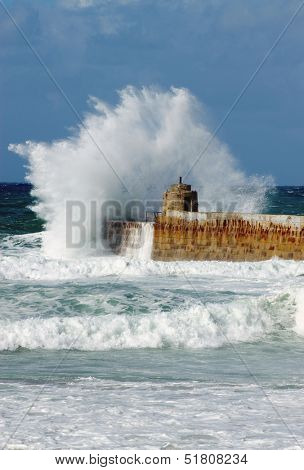 Big white water wave splash, Portreath pier, Cornwall England.
