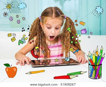 Surprised little girl and her magic tablet