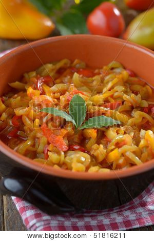 Lecso in a pan on a rustic table
