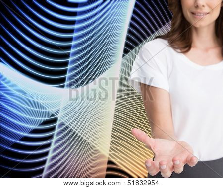 Composite image of businesswoman presenting her empty hand on abstract black background