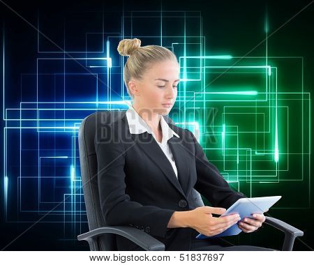 Composite image of businesswoman sitting on swivel chair with tablet on black background with neon lines