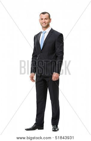 Full-length portrait of business man, isolated on white. Concept of leadership and success