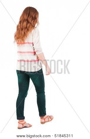 back view of walking  woman . beautiful redhead girl in motion.  backside view of person.  Rear view people collection. Isolated over white background. A girl with flying red hair walks past us