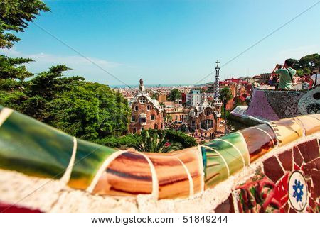 BARCELONA, SPAIN - JULY 19: Ceramic mosaic Park Guell on July 19, 2013 in Barcelona, Spain. Park Guell is the famous architectural town art designed by Antoni Gaudi and built in the years 1900 to 1914