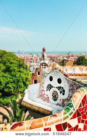 BARCELONA, SPAIN - JULY 19: Ceramic mosaic Park Guell on July 19, 2013 in Barcelona, Spain. Park Guell is the famous architectural town art designed by Antoni Gaudi and built in the years 1900 to 1914