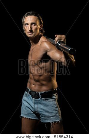 Bodybuilder Exercising Isolated On Black Background