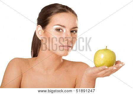 A portrait of beautiful young woman with a green apple on her hand - on white background