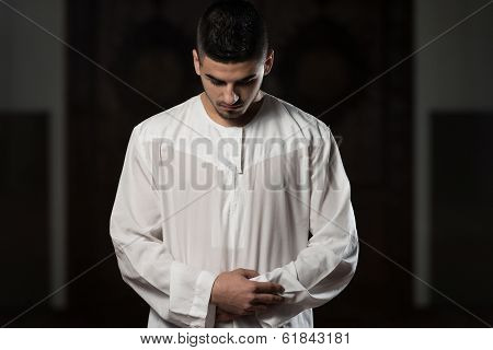 Close-up Of Male Hands Praying In Mosque