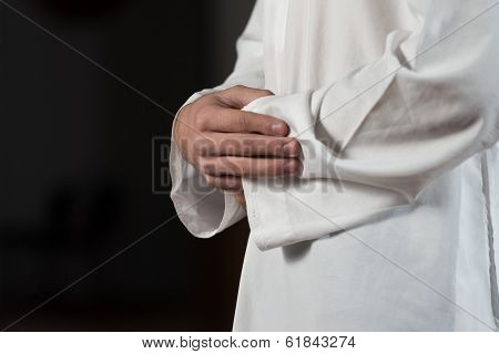Close-up Of Male Hands Praying In Mosque