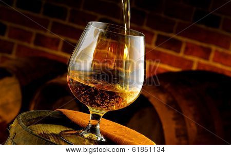 Glass of cognac tasting in the cellar