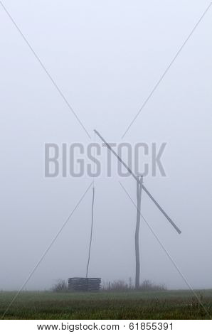 Shadoof In Fog Vertical